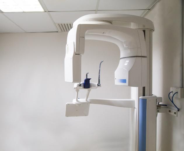 3 D cone beam imaging scanner against white wall