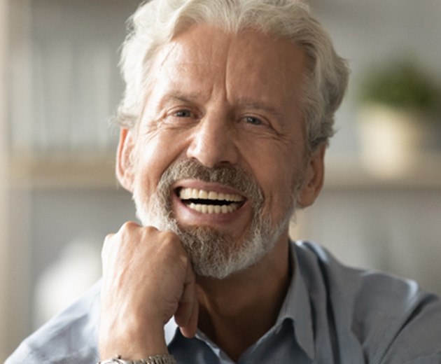 Man smiling with all-on-4 dental implants