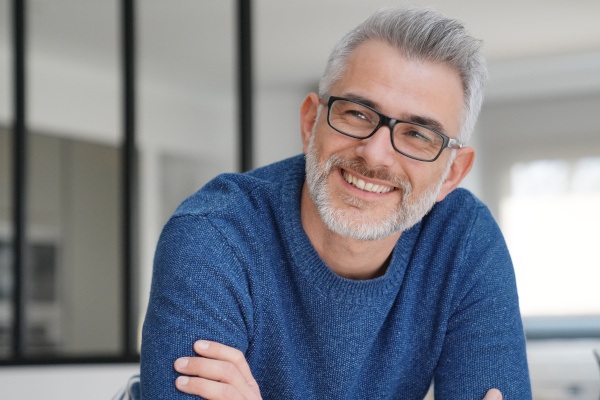 closeup of man smiling after getting dental implants