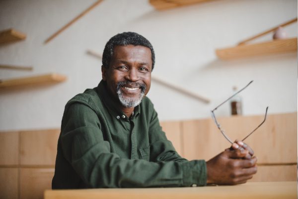 closeup of man smiling after getting dental implants 