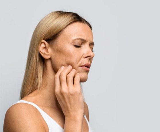 Woman struggling with oral pain