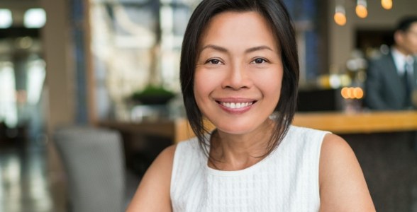 Smiling woman sitting in coffee shop